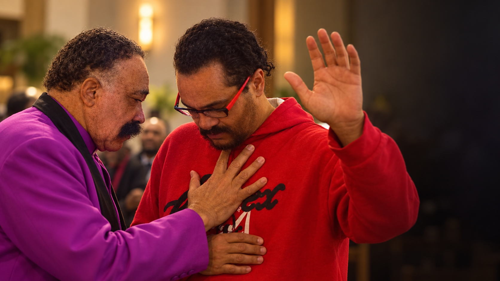 A ministry leader praying with a man at the altar